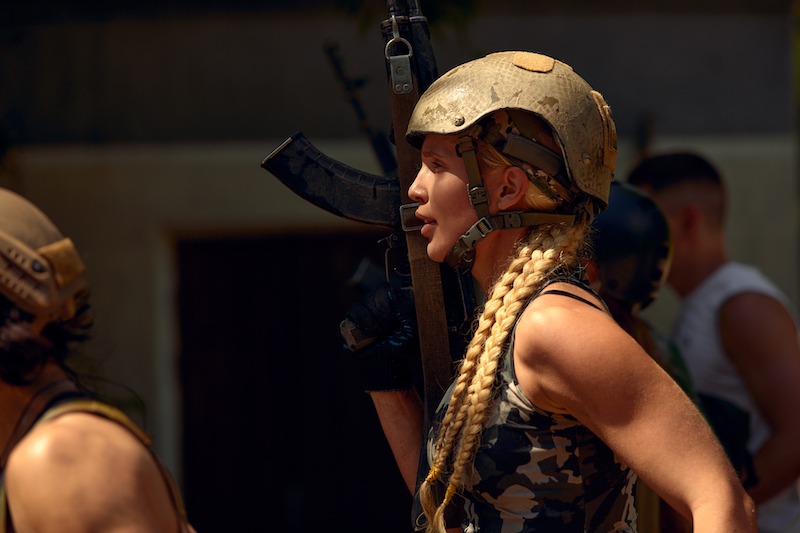 Women's Tactical Gear with a helmet and gun